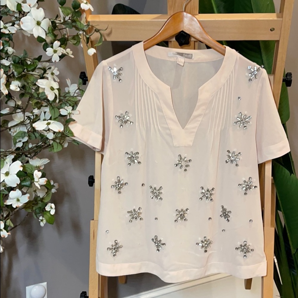 Light pink jeweled blouse